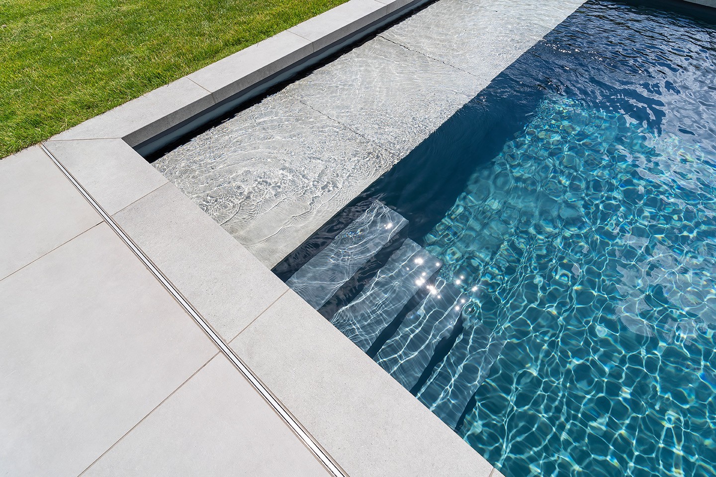 The Living Pool by Biotop with flat stone steps