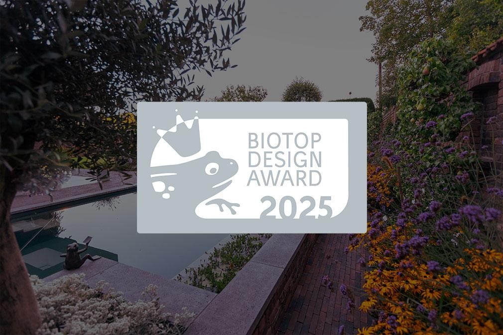 Biotop Design Award 2025 logo in front of natural pool garden