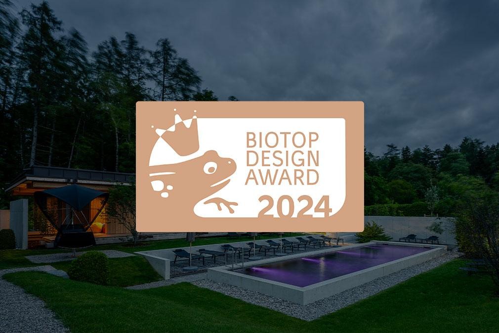 Large biopool in the hotel garden with loungers and modern architecture