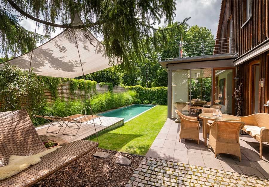 This Living Pool blends in perfectly with the outdoor area and the small garden