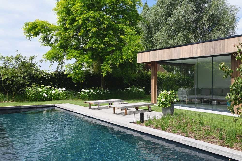 Biotop Living Pool with modern poolhouse in a well-kept garden with terrace and natural pool