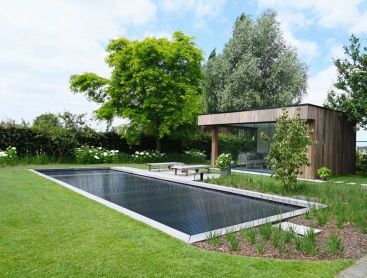 Biotop Living Pool with modern terrace and poolhouse in a stylish garden