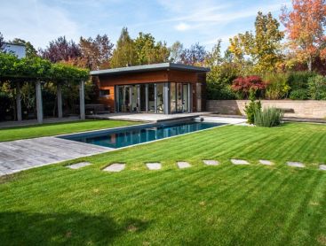 A low maintenance Living Pool from Biotop surrounded by rolled turf