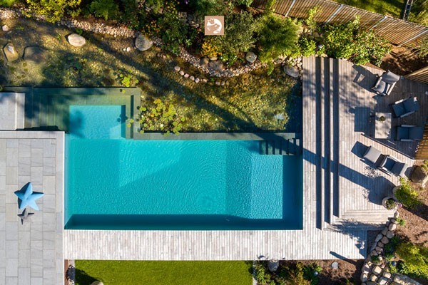 View of an idyllic garden with a dreamlike natural pool