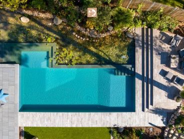 View of an idyllic garden with a dreamlike natural pool