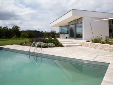 Living Pool in Austria Complements House Architecture