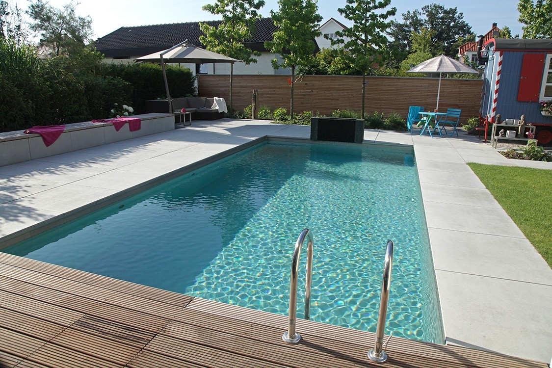 Living Pool in Germany Featuring a Creative Bathhouse