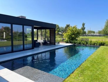 Modern natural pool in elegant design with crystal clear water in Belgium