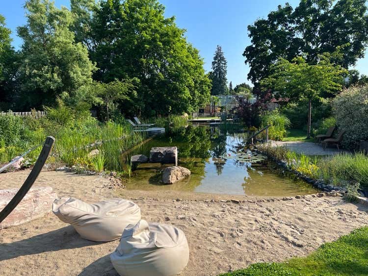 Dreamlike garden with a natural Swimming Pond and a fine sandy beach