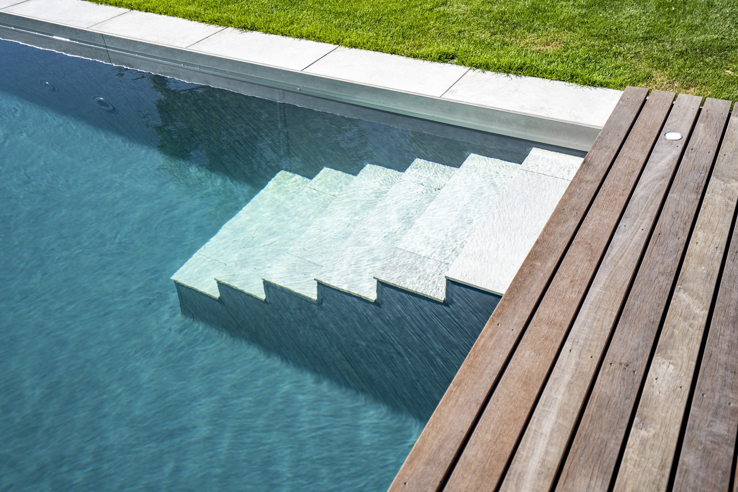 Living Pool with stone steps and clear water