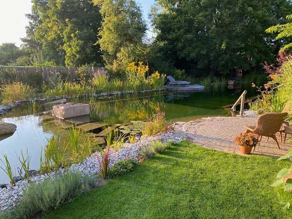 Idyllic natural pool with seating area to relax and enjoy nature