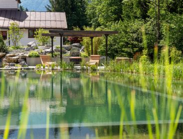 swimming-pond-with-stepping-stones-and-waterfall-Ruhpolding-DE